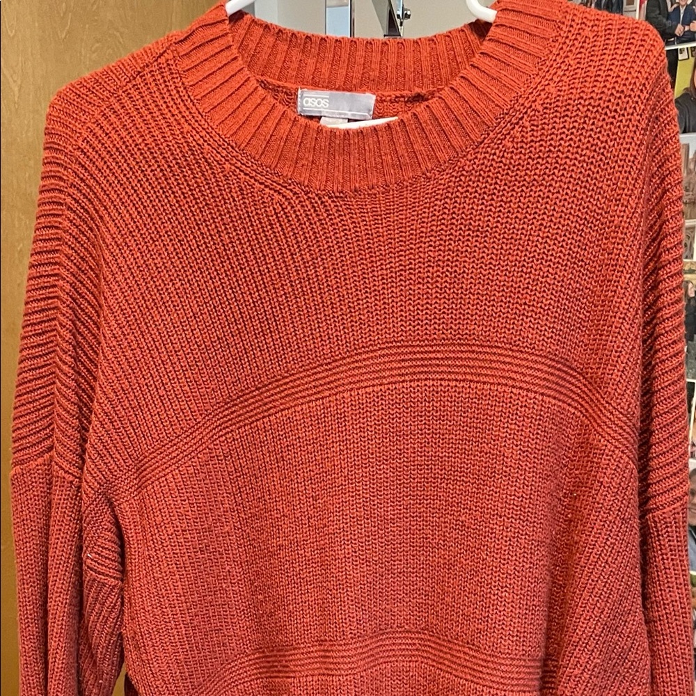 Knitted burnt orange long sleeved dress.